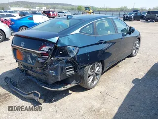 2018 Honda Clarity Touring z VIN JHMZC5F32JC001730, wystawiony jako IAAI lot #41718456 z przebiegiem 64 619 mil mil oraz . Historia ofert i sprzedaży dostępna na DreamBid. Obrazek 4.