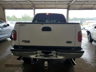 2003 Ford F-150 XLT with VIN 1FTRW08L23KA65560, listed as a Copart auction lot 61349145 with 207,887 mi miles and Salvage title. Bid and sale history available at DreamBid. Image 6.