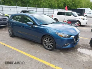 2018 Mazda 3 Touring z VIN 3MZBN1L38JM235604, wystawiony jako IAAI lot #42333995 z przebiegiem 69 541 mil mil oraz . Historia ofert i sprzedaży dostępna na DreamBid. Obrazek 1.