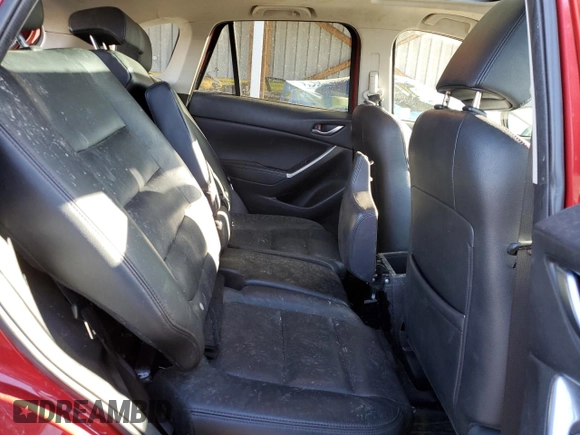 2016 Mazda CX-5 Grand Touring z VIN JM3KE4DY9G0753691, wystawiony jako Copart lot #57361645 z przebiegiem 90 733 mil mil oraz Szkoda całkowita • Salvage title. Historia ofert i sprzedaży dostępna na DreamBid. Obrazek 11.
