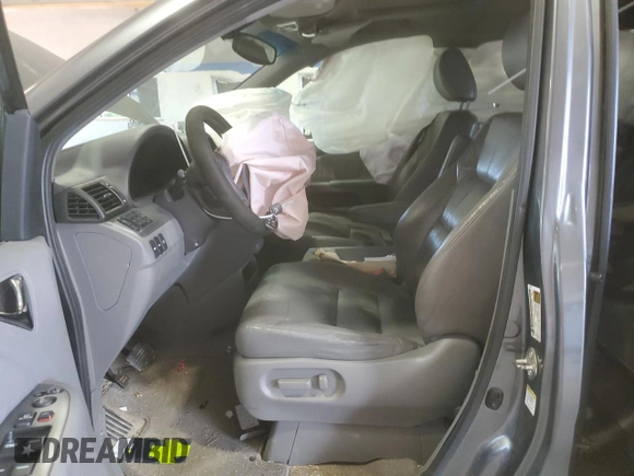 2010 Honda Odyssey Touring with VIN 5FNRL3H91AB113770, listed as a Copart auction lot 61893115 with 155,776 mi miles and Salvage title. Bid and sale history available at DreamBid. Image 7.