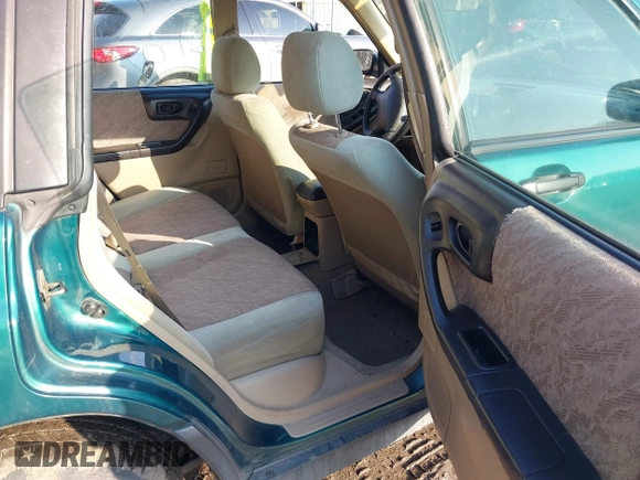 1999 Subaru Forester L with VIN JF1SF635XXH735202, listed as a IAAI auction lot 41489355 with 290,000 mi miles. Bid and sale history available at carsss.com. Image 8.
