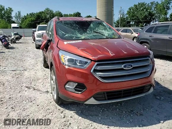 2019 Ford Escape Titanium z VIN 1FMCU9J90KUC24993, wystawiony jako Copart lot #61917895 z przebiegiem 57 101 mil mil oraz Czysty tytuł • Clean title. Historia ofert i sprzedaży dostępna na DreamBid. Obrazek 14.