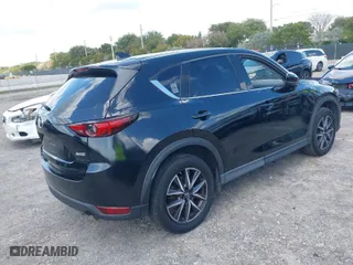2018 Mazda CX-5 Grand Touring with VIN JM3KFBDM2J0390611, listed as a IAAI auction lot 42006482 with 97,497 mi miles. Bid and sale history available at carsss.com. Image 4.