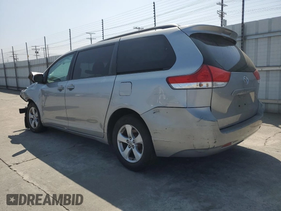 2012 Toyota Sienna LE AAS with VIN 5TDKK3DC2CS207404, listed as a Copart auction lot 62781215 with 200,757 mi miles and Salvage title. Bid and sale history available at DreamBid. Image 2.