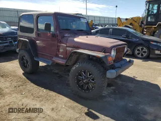 2002 Jeep Wrangler Sahara with VIN 1J4FA59S12P704608, listed as a Copart auction lot 69146504 with 125,920 mi miles and Salvage Title. Bid and sale history available at carsss.com. Image 4.