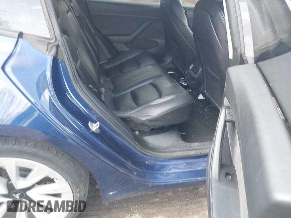 2022 Tesla Model 3 with VIN 5YJ3E1EA7NF188417, listed as a IAAI auction lot 41885623 with 105,457 mi miles and . Bid and sale history available at DreamBid. Image 8.