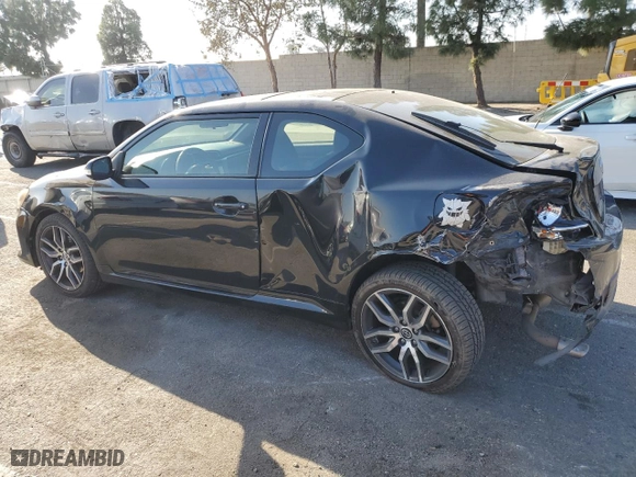 2016 Scion tC with VIN JTKJF5C79GJ020110, listed as a Copart auction lot 86995214 with 79,165 mi miles and Salvage Title. Bid and sale history available at carsss.com. Image 2.