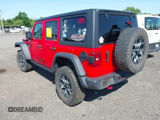 2021 Jeep Wrangler Unlimited Rubicon with VIN 1C4HJXFG2MW575541, listed as a IAAI auction lot 42247475 with 92,353 mi miles and . Bid and sale history available at DreamBid. Image 3.