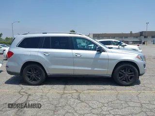 2014 Mercedes-Benz GL 450 z VIN 4JGDF7CE9EA411572, wystawiony jako IAAI lot #42461631 z przebiegiem 121 885 mil mil oraz . Historia ofert i sprzedaży dostępna na DreamBid. Obrazek 13.