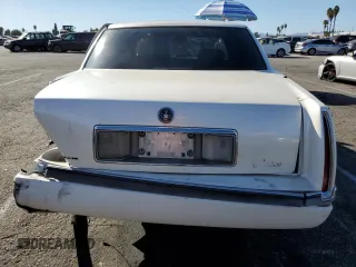 1995 Cadillac Concours z VIN 1G6KF52Y0SU301356, wystawiony jako Copart lot #77372694 z przebiegiem 132 934 mil mil oraz Szkody całkowita. Historia ofert i sprzedaży dostępna na DreamBid. Obrazek 6.