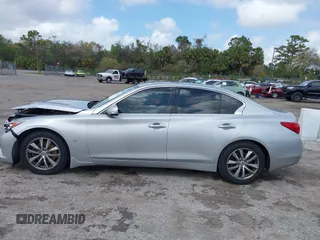 2014 Infiniti Q50 Premium z VIN JN1BV7AP9EM690381, wystawiony jako IAAI lot #41761562 z przebiegiem 107 099 mil mil oraz . Historia ofert i sprzedaży dostępna na DreamBid. Obrazek 14.