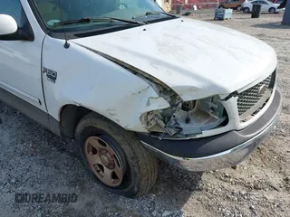 2001 Ford F-150 XL z VIN 1FTRX17WX1NA20036, wystawiony jako IAAI lot #42231600 z przebiegiem 181 549 mil mil oraz . Historia ofert i sprzedaży dostępna na DreamBid. Obrazek 6.