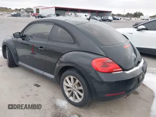 2013 Volkswagen Beetle Entry with VIN 3VWFP7AT8DM644840, listed as a IAAI auction lot 41387843 with 195,597 mi miles and . Bid and sale history available at DreamBid. Image 3.