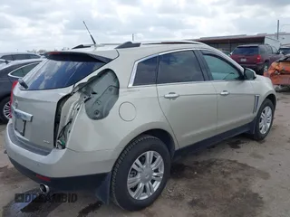 2014 Cadillac SRX Luxury Collection z VIN 3GYFNBE31ES628346, wystawiony jako IAAI lot #41709425 z przebiegiem 47 634 mil mil oraz . Historia ofert i sprzedaży dostępna na DreamBid. Obrazek 4.