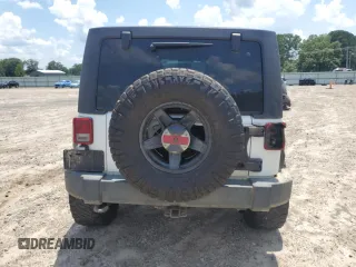 2015 Jeep Wrangler Unlimited Rubicon with VIN 1C4BJWFG6FL710993, listed as a Copart auction lot 62308195 with 103,938 mi miles and Salvage title. Bid and sale history available at DreamBid. Image 6.