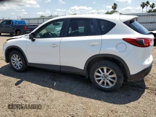 2014 Mazda CX-5 Touring with VIN JM3KE2CY9E0305244, listed as a Copart auction lot 56205605 with 164,516 mi miles and Salvage Title. Bid and sale history available at DreamBid. Image 2.