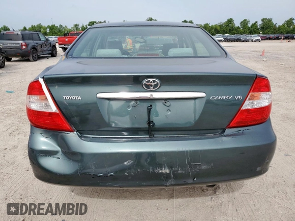 2003 Toyota Camry LE z VIN 4T1BF32K13U554339, wystawiony jako Copart lot #55972595 z przebiegiem 69 549 mil mil oraz Szkoda całkowita • Salvage title. Historia ofert i sprzedaży dostępna na DreamBid. Obrazek 6.