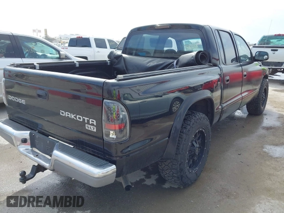 2004 Dodge Dakota SLT with VIN 1D7HL48N04S654059, listed as a IAAI auction lot 41811540 with 165,615 mi miles. Bid and sale history available at carsss.com. Image 4.