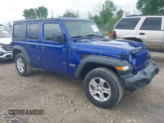 2019 Jeep Wrangler Unlimited Sport S with VIN 1C4HJXDG2KW572400, listed as a IAAI auction lot 42458286 with 148,622 mi miles and . Bid and sale history available at DreamBid. Image 1.