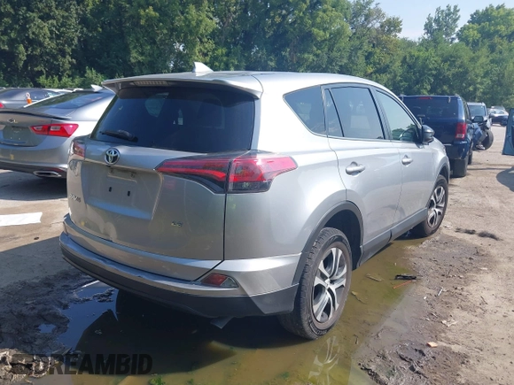 2018 Toyota RAV4 LE with VIN JTMZFREV3JJ161811, listed as a IAAI auction lot 40131640 with 114,330 mi miles. Bid and sale history available at carsss.com. Image 4.
