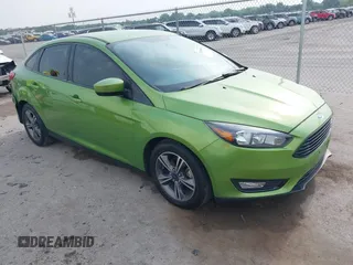 2018 Ford Focus SE z VIN 1FADP3FE5JL222542, wystawiony jako IAAI lot #42265608 z przebiegiem 107 397 mil mil oraz . Historia ofert i sprzedaży dostępna na DreamBid. Obrazek 1.
