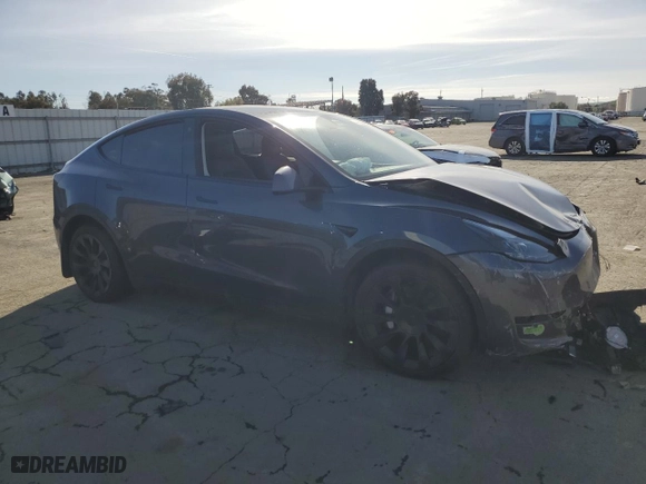 2023 Tesla Model Y Long Range with VIN 7SAYGDEE6PF637757, listed as a Copart auction lot 49819855 with 0 mi miles and Salvage Title. Bid and sale history available at carsss.com. Image 4.