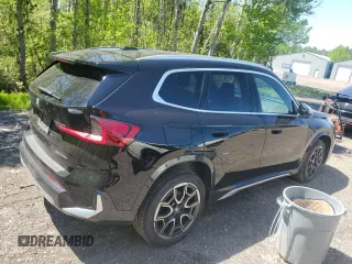 2023 BMW X1 xDrive28i with VIN WBX73EF04P5X86962, listed as a Copart auction lot 57575815 with 95,965 mi miles and Salvage title. Bid and sale history available at DreamBid. Image 3.
