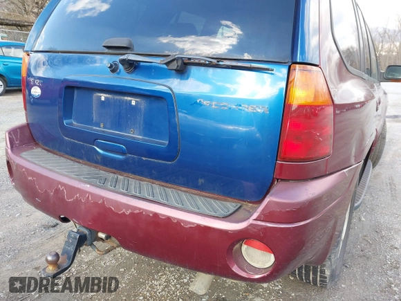 2004 GMC Envoy SLE with VIN 1GKDS13S342287315, listed as a IAAI auction lot 41486715 with 186,129 mi miles. Bid and sale history available at carsss.com. Image 13.