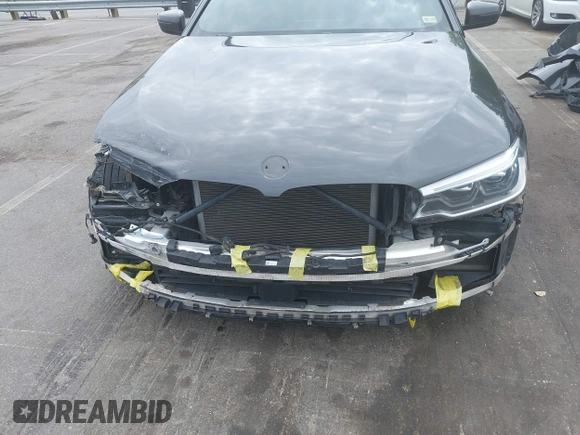 2018 BMW 5 Series M550i xDrive with VIN WBAJB9C56JB035364, listed as a IAAI auction lot 42179145 with 112,123 mi miles and . Bid and sale history available at DreamBid. Image 6.