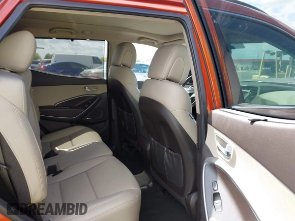 2014 Hyundai Santa Fe z VIN 5XYZUDLB4EG138898, wystawiony jako IAAI lot #42196491 z przebiegiem Nie podano mil oraz . Historia ofert i sprzedaży dostępna na DreamBid. Obrazek 8.
