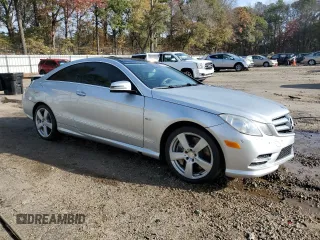 2012 Mercedes-Benz E 550 with VIN WDDKJ7DB2CF151973, listed as a Copart auction lot 82667474 with 130,590 mi miles and Salvage Title. Bid and sale history available at DreamBid. Image 4.