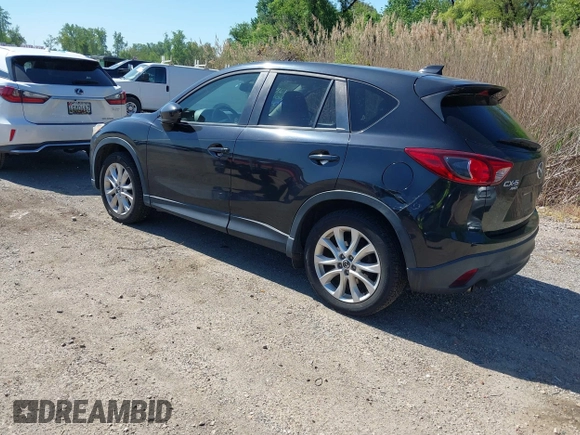 2013 Mazda CX-5 Grand Touring with VIN JM3KE4DE6D0127601, listed as a IAAI auction lot 42143558 with 95,719 mi miles and . Bid and sale history available at DreamBid. Image 3.