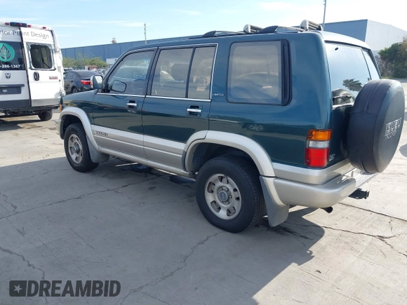 1996 Isuzu Trooper z VIN JACDJ58V4T7918002, wystawiony jako IAAI lot #41700255 z przebiegiem 203 951 mil mil oraz . Historia ofert i sprzedaży dostępna na DreamBid. Obrazek 3.