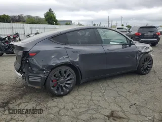 2024 Tesla Model Y Performance with VIN 7SAYGDEF7RF093054, listed as a Copart auction lot 50747985 with 26,907 mi miles and Salvage Title. Bid and sale history available at DreamBid. Image 3.