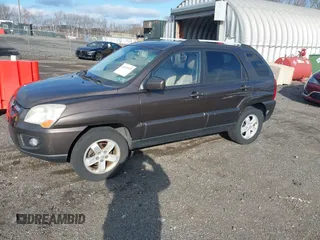 2009 Kia Sportage LX with VIN KNDJE723097623239, listed as a IAAI auction lot 41233933 with 169,444 mi miles. Bid and sale history available at carsss.com. Image 2.