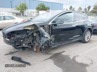 2017 Tesla Model X 90D with VIN 5YJXCAE2XHF075341, listed as a IAAI auction lot 41784008 with 77,439 mi miles and . Bid and sale history available at DreamBid. Image 18.