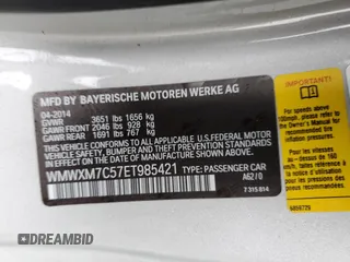 2014 MINI Hardtop S with VIN WMWXM7C57ET985421, listed as a Copart auction lot 49443335 with 76,168 mi miles and Salvage Title. Bid and sale history available at DreamBid. Image 16.