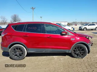 2016 Ford Escape Titanium with VIN 1FMCU9J98GUB42453, listed as a IAAI auction lot 41760110 with 116,452 mi miles. Bid and sale history available at carsss.com. Image 14.