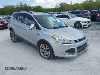 2016 Ford Escape SE with VIN 1FMCU9G92GUC28879, listed as a IAAI auction lot 42021065 with 99,184 mi miles. Bid and sale history available at carsss.com. Image 1.