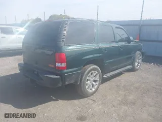 2004 GMC Yukon Denali with VIN 1GKEK63U24J265167, listed as a IAAI auction lot 41877785 with 256,691 mi miles. Bid and sale history available at carsss.com. Image 4.