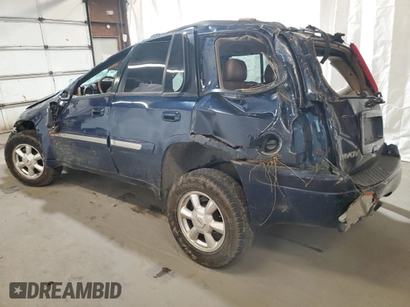 2003 GMC Envoy SLT with VIN 1GKDT13S032165927, listed as a Copart auction lot 68561634 with 0 mi miles and Salvage Title. Bid and sale history available at carsss.com. Image 2.