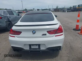 2015 BMW M6 z VIN WBS6C9C50FD467538, wystawiony jako IAAI lot #42366043 z przebiegiem 66 379 mil mil oraz . Historia ofert i sprzedaży dostępna na DreamBid. Obrazek 16.