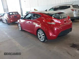 2012 Hyundai Veloster w/Gray Int z VIN KMHTC6AD3CU023998, wystawiony jako IAAI lot #42186875 z przebiegiem 170 771 mil mil oraz . Historia ofert i sprzedaży dostępna na DreamBid. Obrazek 3.