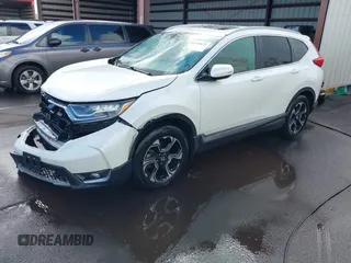 2018 Honda CR-V Touring with VIN 2HKRW1H96JH506435, listed as a IAAI auction lot 41228873 with 11,585 mi miles and . Bid and sale history available at DreamBid. Image 2.