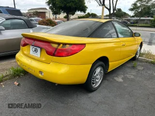 2001 Saturn SC with VIN 1G8ZY12771Z105142, listed as a Copart auction lot 54940825 with 166,396 mi miles and Clean Title. Bid and sale history available at carsss.com. Image 4.