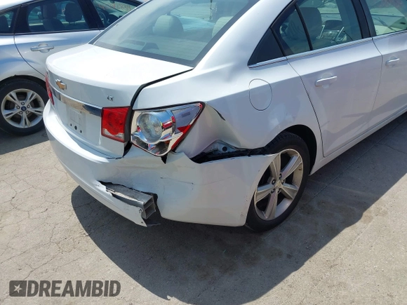 2014 Chevrolet Cruze 2LT z VIN 1G1PE5SBXE7168795, wystawiony jako IAAI lot #42285484 z przebiegiem 104 317 mil mil oraz . Historia ofert i sprzedaży dostępna na DreamBid. Obrazek 6.