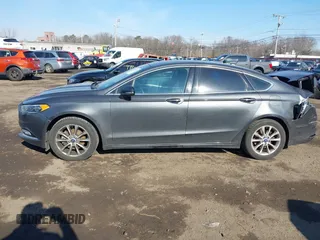 2017 Ford Fusion SE z VIN 3FA6P0HDXHR321008, wystawiony jako IAAI lot #41620779 z przebiegiem 110 116 mil mil oraz . Historia ofert i sprzedaży dostępna na DreamBid. Obrazek 14.