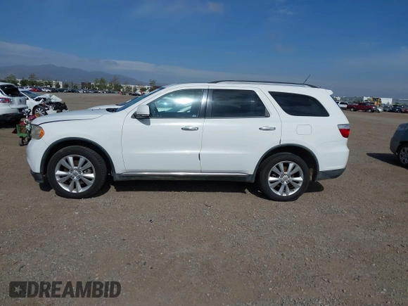 2013 Dodge Durango Crew with VIN 1C4SDHDT2DC679600, listed as a IAAI auction lot 42215737 with 128,499 mi miles and . Bid and sale history available at DreamBid. Image 14.
