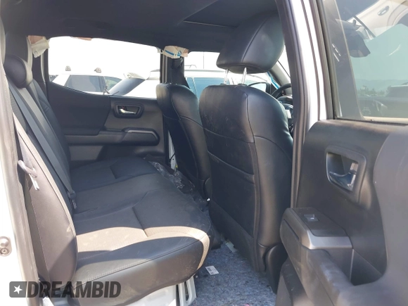 2023 Toyota Tacoma SR with VIN 3TMCZ5AN7PM630874, listed as a IAAI auction lot 40298041 with 8,635 mi miles and . Bid and sale history available at DreamBid. Image 8.